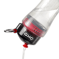 ÖKO red ultra-filtering water bottle in use